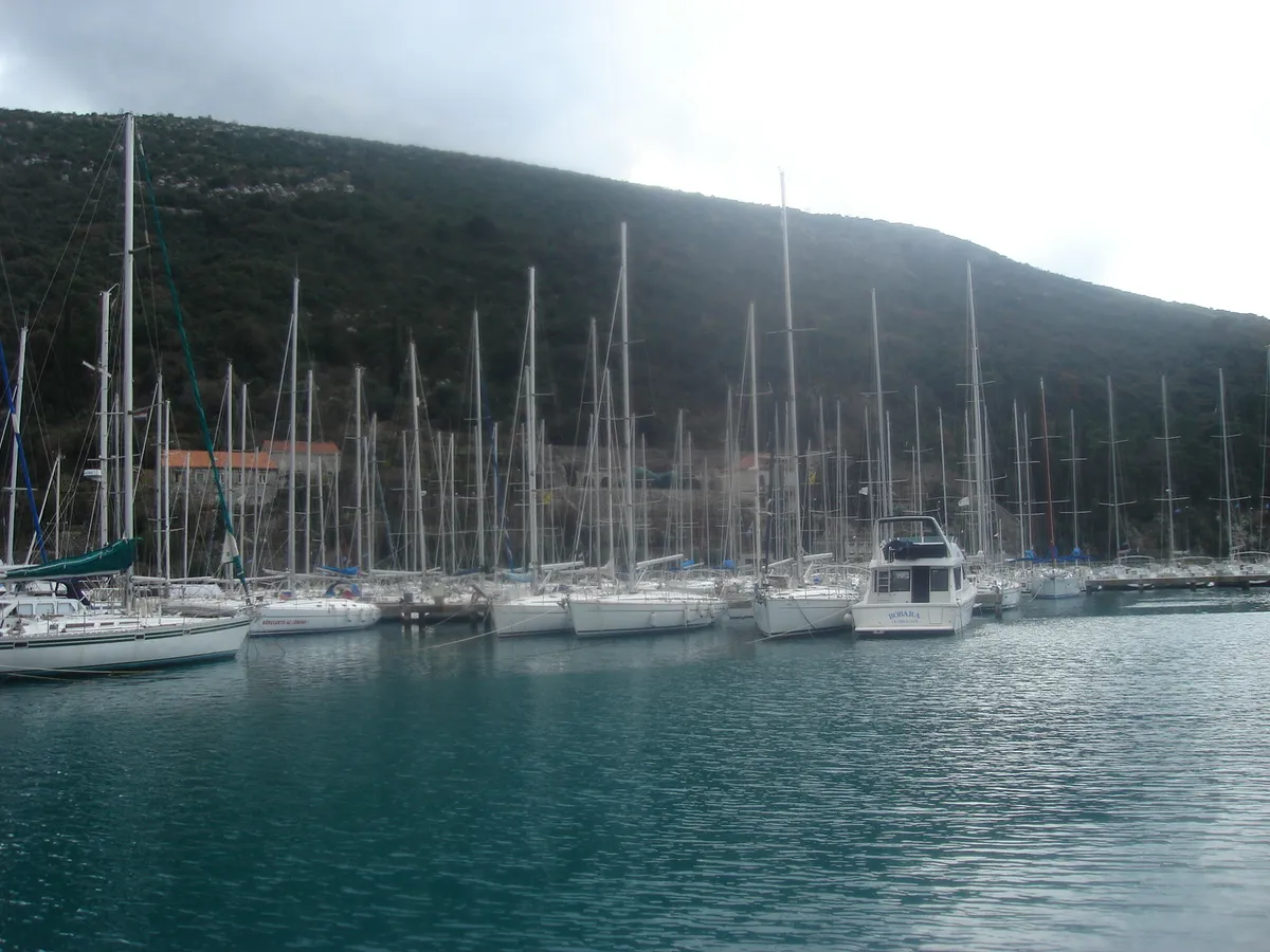 Yachts moored on the pontoons of ACI Marina Dubrovnik at Komolac, with the steep wooded hillside of the Rijeka Dubrovačka behind