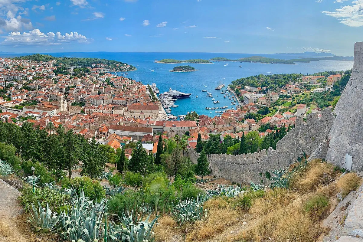 Hvar town harbour full of yachts, with the Pakleni islands beyond, seen from the Spanish fortress (Španjola)