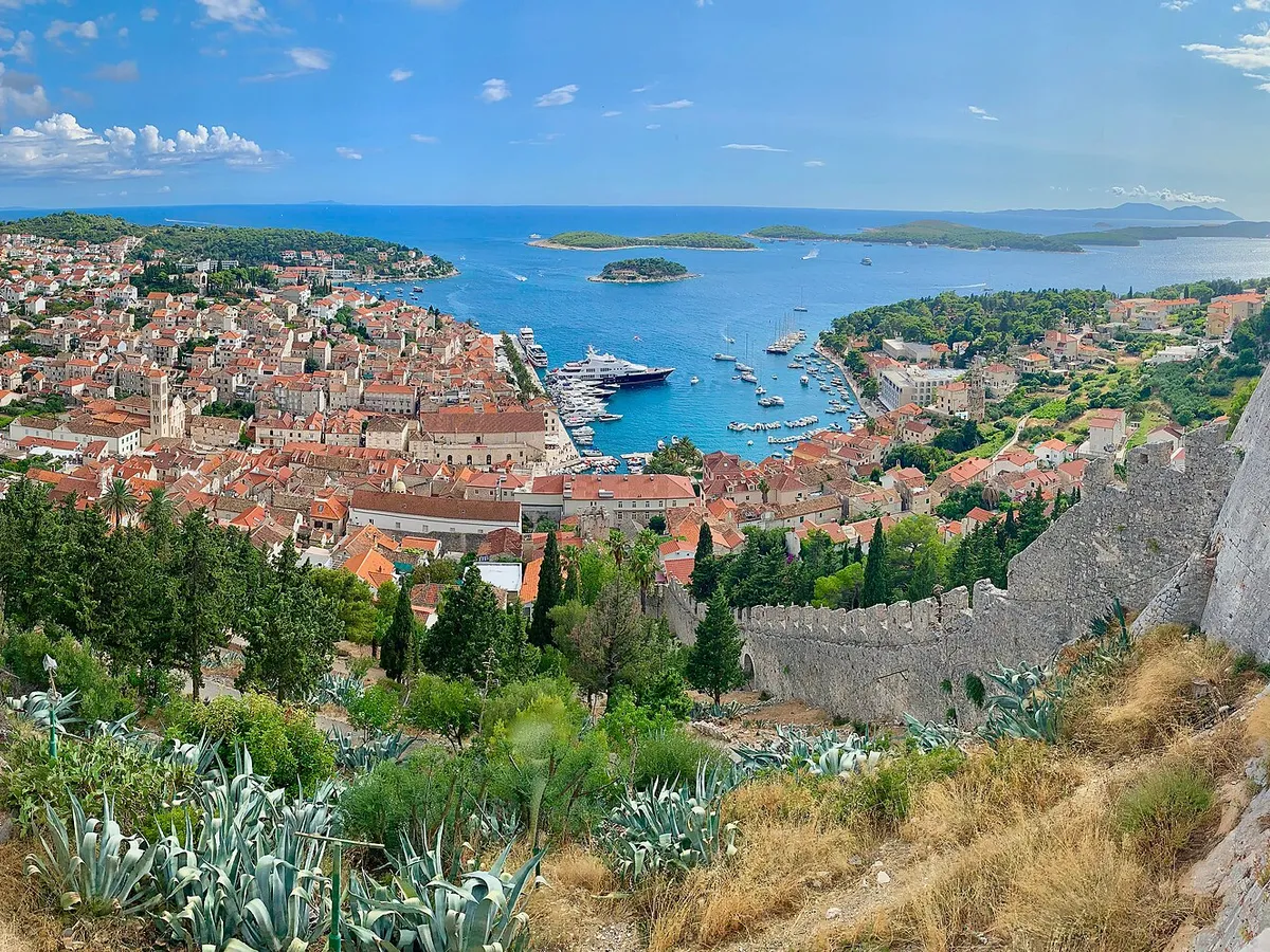 Hvar town harbour full of yachts, with the Pakleni islands beyond, seen from the Spanish fortress (Španjola)