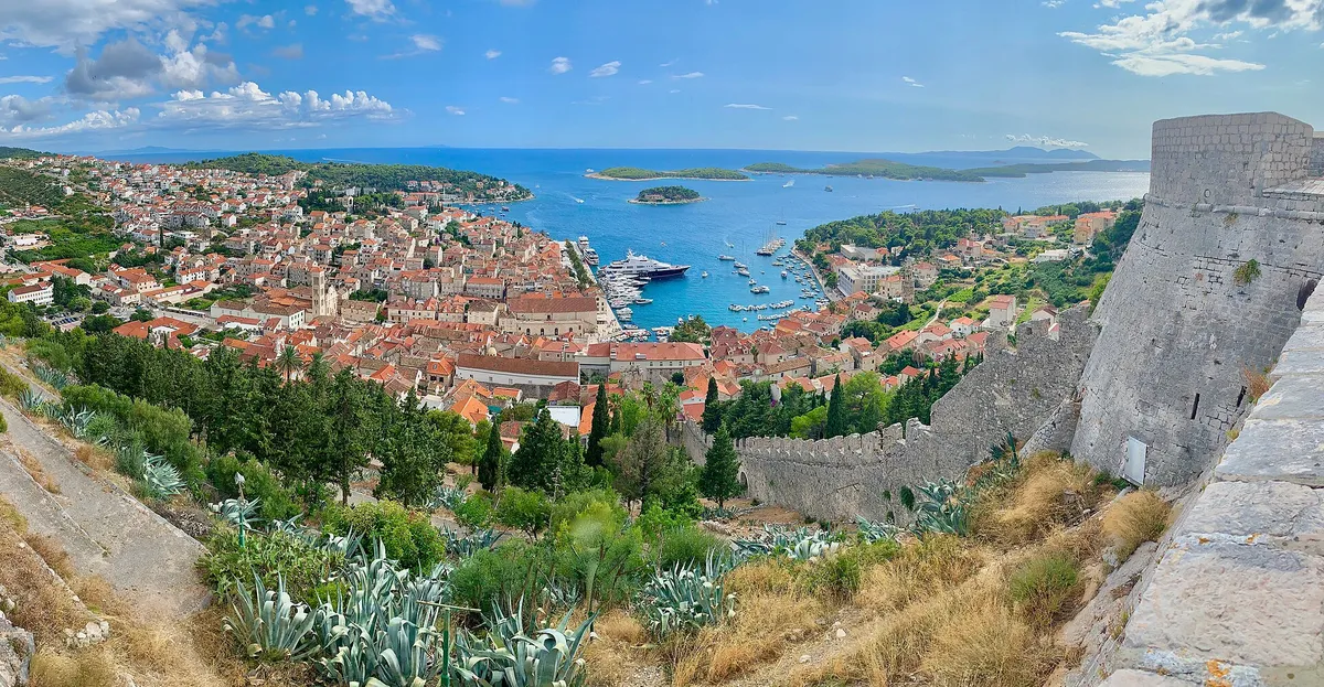 Hvar town harbour full of yachts, with the Pakleni islands beyond, seen from the Spanish fortress (Španjola)