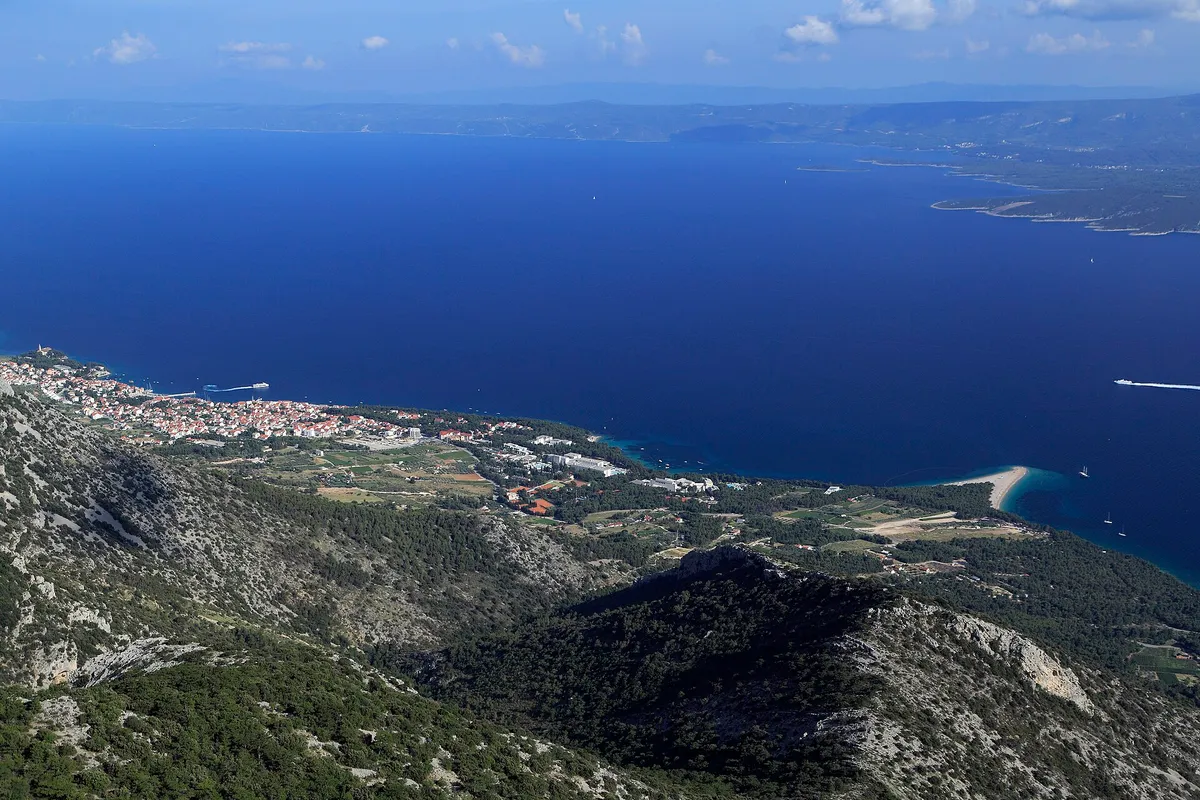 The view from Vidova Gora down to Bol and the Zlatni Rat spit, across the Hvar channel to Hvar island.