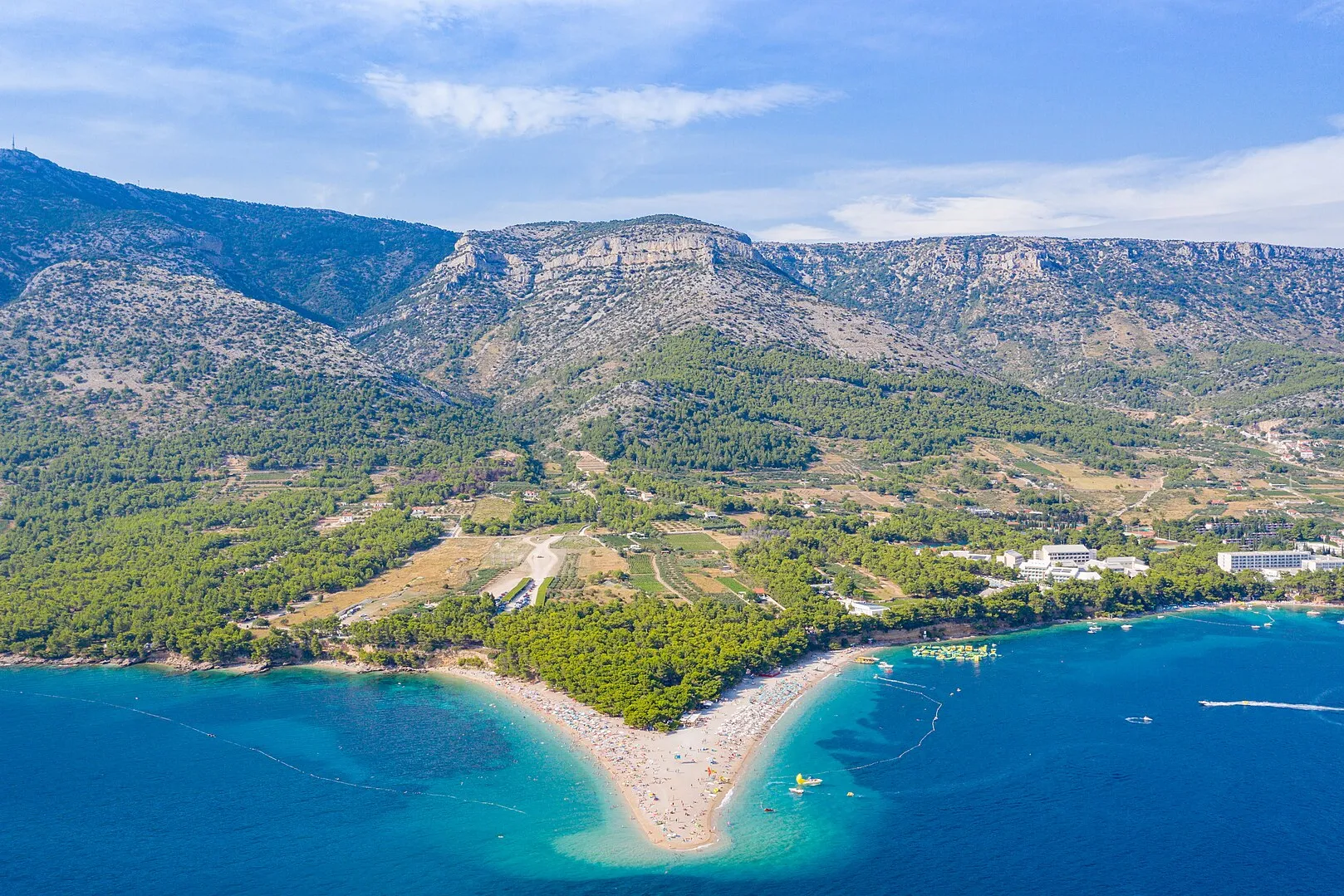Aerial of Zlatni rat beach at Bol with Vidova Gora mountain behind